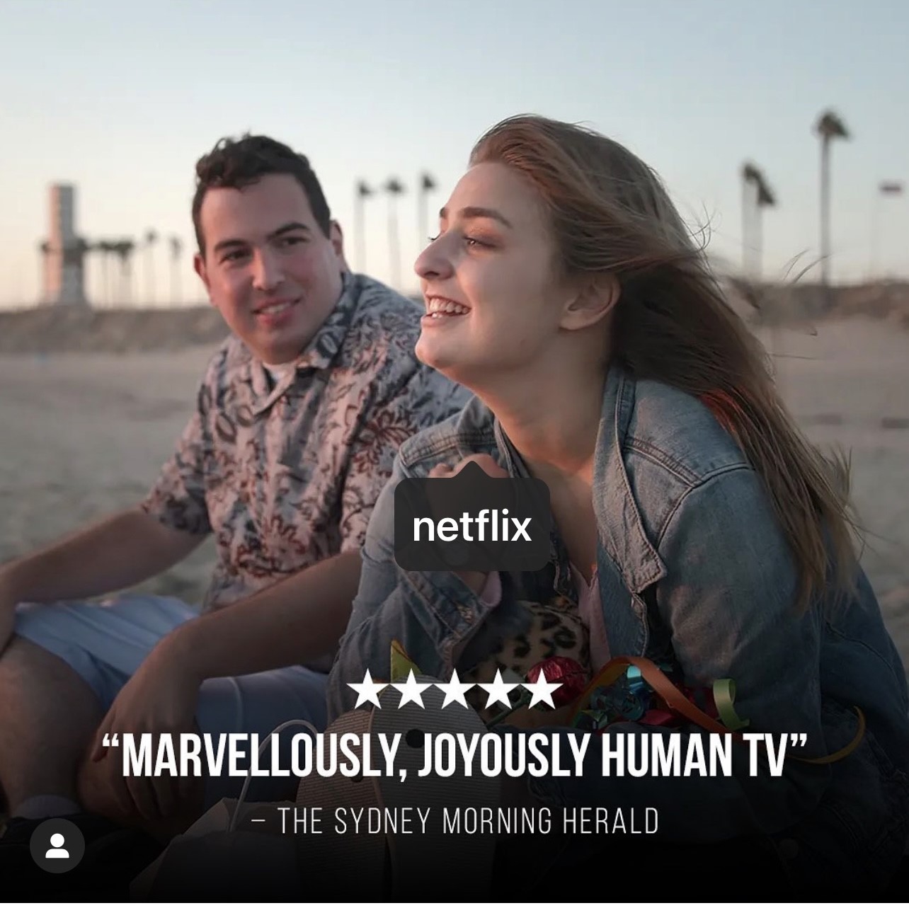 Abbey in a promo photo for Love On The Spectrum US, with a 5 star rating at the bottom, and a quote from The Sydney Morning Herald, saying "Marvelously, Joyously Human TV" and a tag to Netflix. 