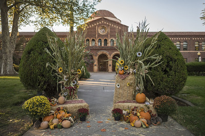 Fall decor in front of Kendall Hall