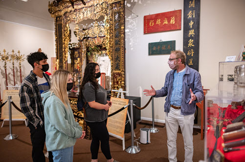 Professor Daniel Veidlinger leads a Chico Museum tour of Chinese cultural relics from Northern California.